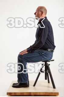 Sitting pose blue deep shirt jeans of Ed 0001